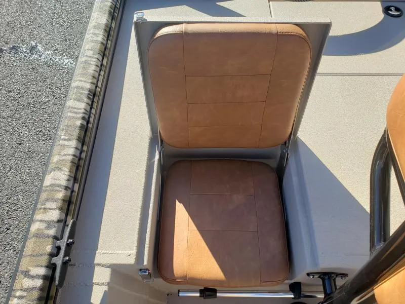 Slide: The Image of 2024 Avid Rogue 20 CC boat seat with tan upholstery and sleek design. - 9