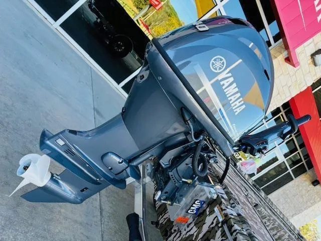 Slide: The Image of 2025 Avid 16 Commander with Yamaha outboard motor, parked outside a building. - 4