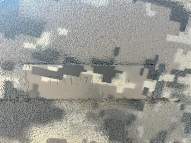 Slide: The Image of 2024 Havoc Boats 1550 VJ hull identification number on camouflage-patterned surface. - 13