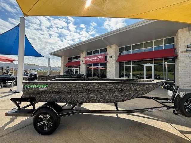 Slide: The Image of 2024 Havoc Boats 1550 VJ displayed outdoors at a dealership. - 3