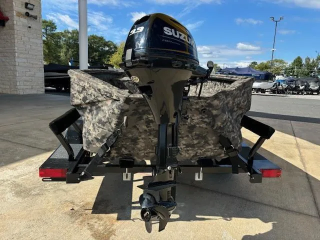 Slide: The Image of 2024 Havoc Boats 1550 VJ with Suzuki outboard motor, camo design, on a trailer. - 7