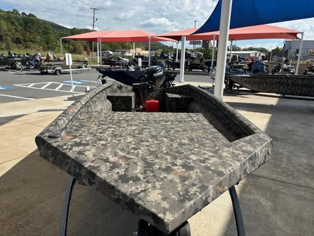 Slide: The Image of 2024 Havoc Boats 1550 VJ with camouflage design displayed outdoors. - 8