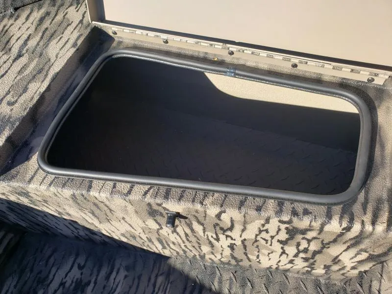Slide: The Image of 2024 Havoc Boats 1756 Dbst storage compartment with camouflage interior design. - 5