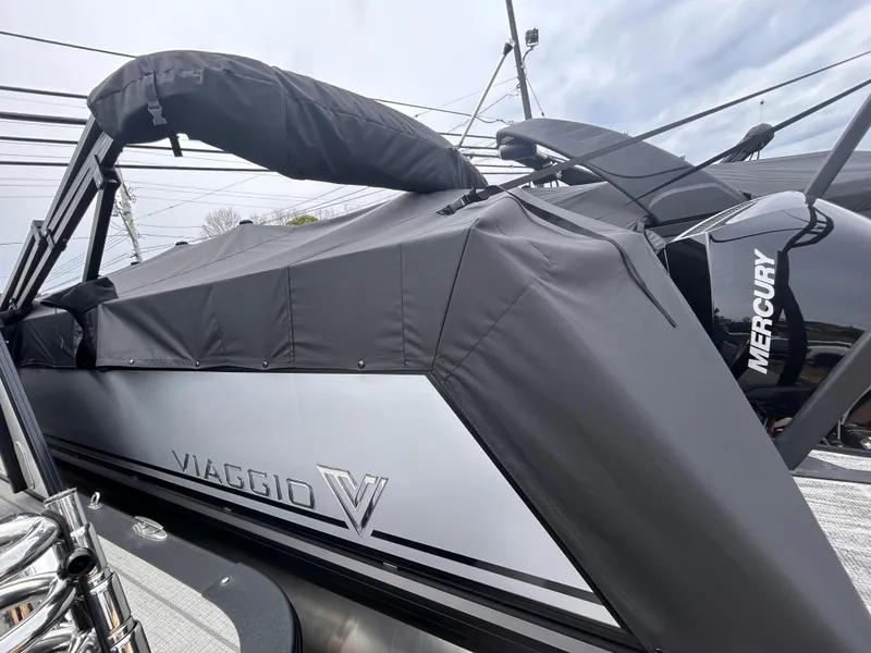 The Image of 2025 Viaggio Lago X-R boat with Mercury engine, covered and docked. - 0