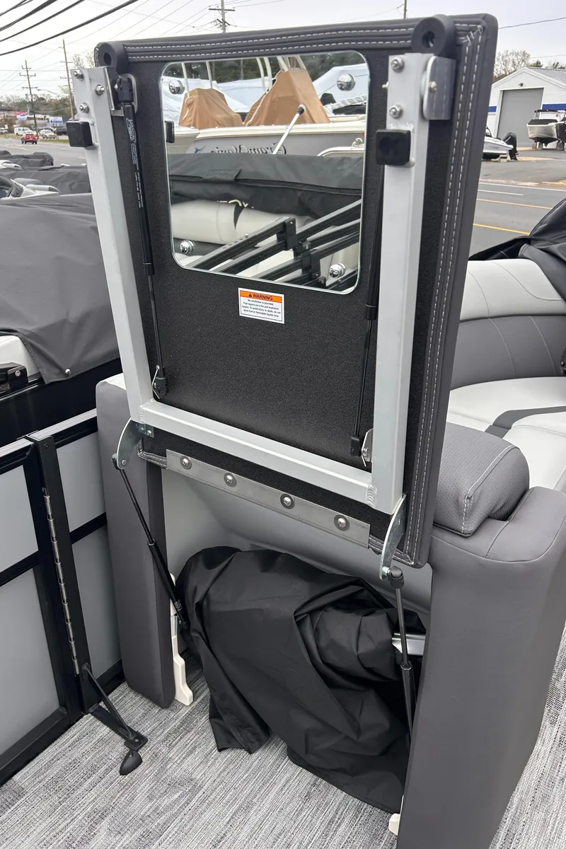 Slide: The Image of 2025 Viaggio Lago X-R boat interior with foldable seat and storage compartment. - 10