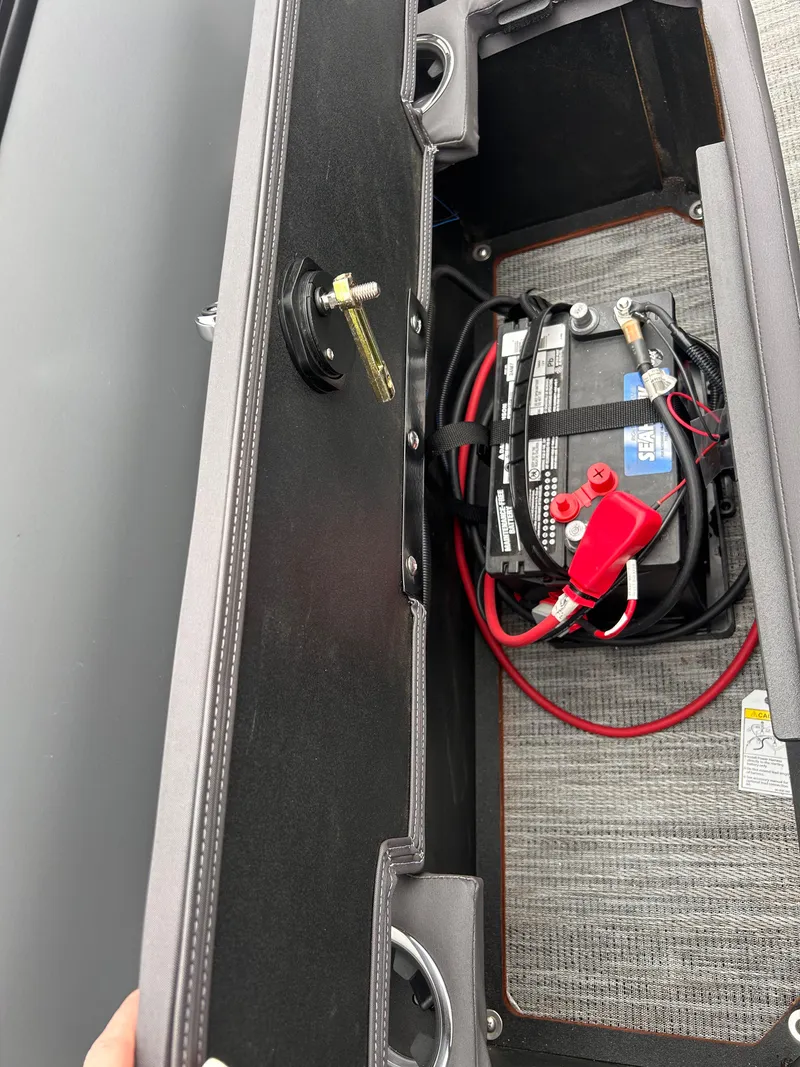 Slide: The Image of Battery compartment of 2025 Viaggio Lago X-R with visible wiring and connections. - 12