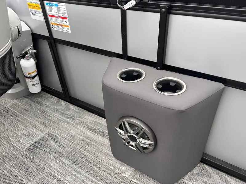 Slide: The Image of Viaggio Lago X-R 2025 boat interior with cup holders and speaker on carpeted floor. - 7