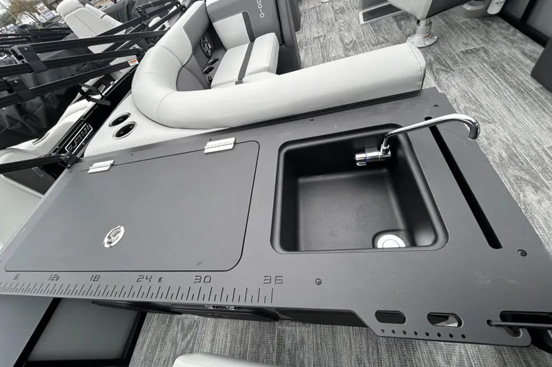 Slide: The Image of 2025 Viaggio Lago X-R boat interior with sink and seating area. - 8