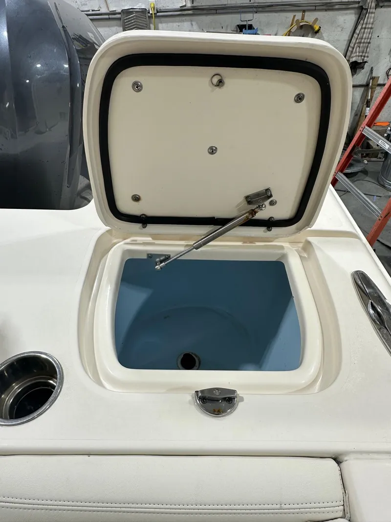Slide: The Image of 2020 Grady-White 271 Canyon boat livewell with open lid in a workshop setting. - 10