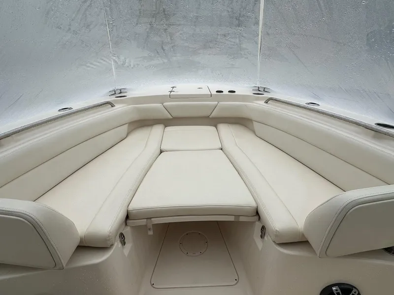 Slide: The Image of 2020 Grady-White 271 Canyon boat interior with beige seating and sleek design. - 5
