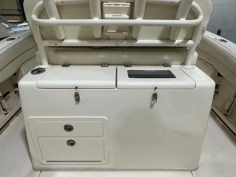 Slide: The Image of 2020 Grady-White 271 Canyon boat interior with storage compartments and seating. - 9