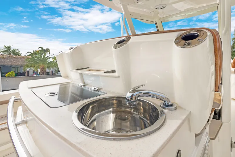 Slide: The Image of 2018 Scout 320 LXF boat with sleek sink and countertop design. - 23