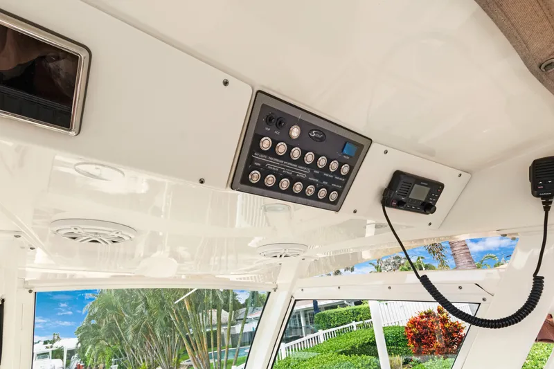 Slide: The Image of 2018 Scout 320 LXF boat interior with control panel and speakers. - 34