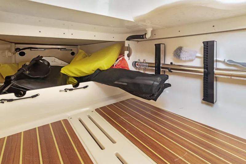 Slide: The Image of Interior storage of 2018 Scout 320 LXF boat with organized compartments and accessories. - 44
