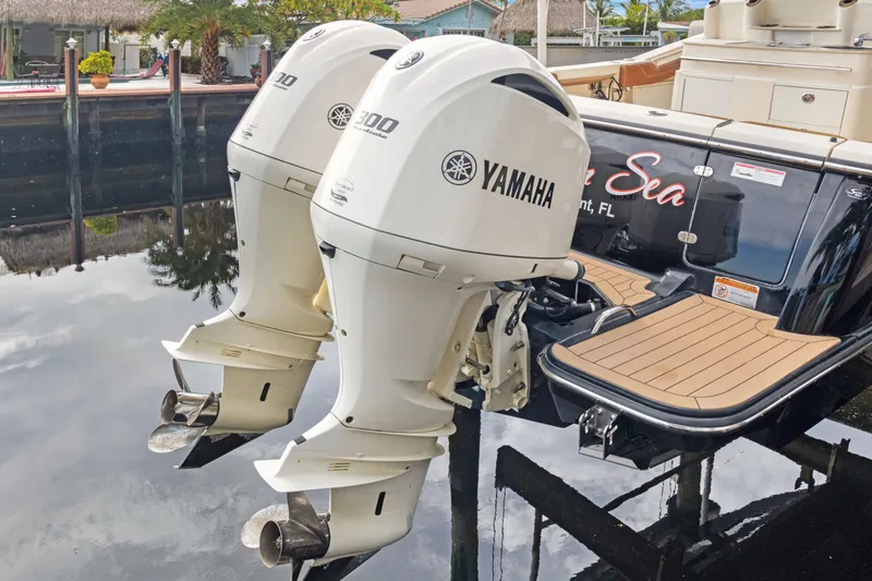 Slide: The Image of 2018 Scout 320 LXF with twin Yamaha outboard engines docked on calm water. - 47