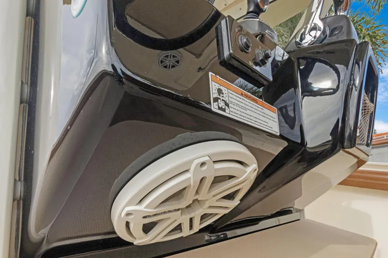 Slide: The Image of 2018 Scout 320 LXF boat dashboard with speaker detail. - 49