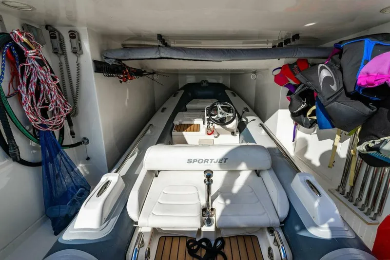 Slide: The Image of 2018 Ferretti Yachts 850 Motor Yacht interior with Sportjet tender and equipment storage. - 20