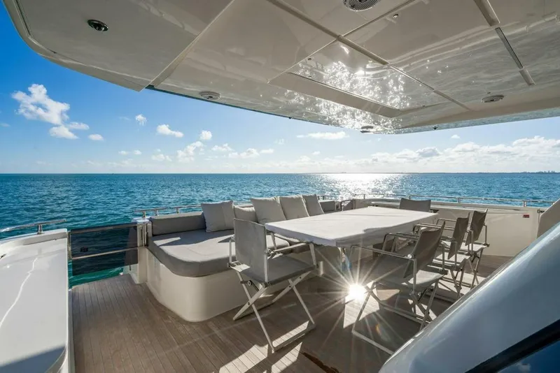 Slide: The Image of 2018 Ferretti Yachts 850 Motor Yacht deck with ocean view and seating area. - 21