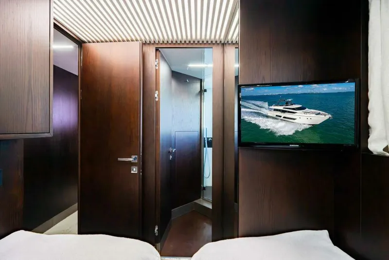 Slide: The Image of Interior of 2018 Ferretti Yachts 850 Motor Yacht with TV and wooden decor. - 45