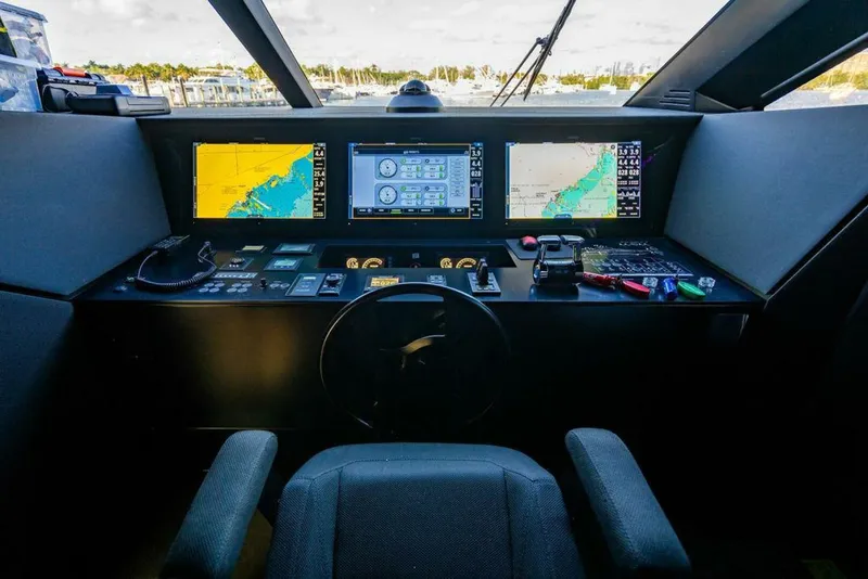 Slide: The Image of Cockpit of 2018 Ferretti Yachts 850 Motor Yacht with navigation screens and controls. - 48