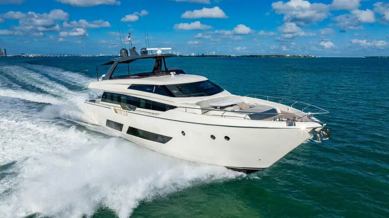 Slide: The Image of 2018 Ferretti Yachts 850 Motor Yacht cruising on open water under blue skies. - 6