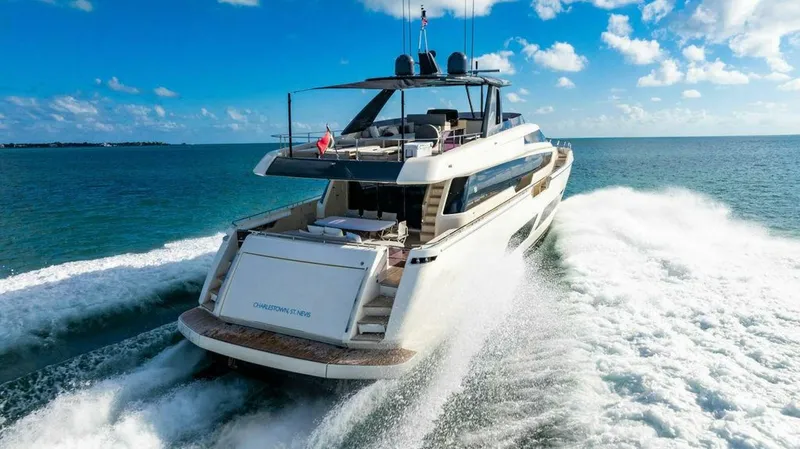 Slide: The Image of 2018 Ferretti Yachts 850 Motor Yacht cruising on open water under a clear blue sky. - 9