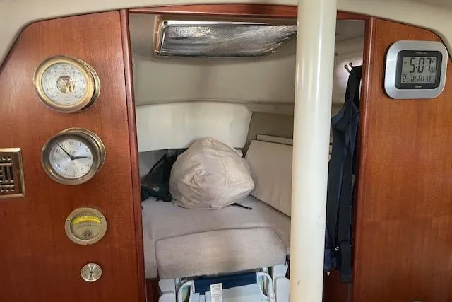 Slide: The Image of Interior of 1991 Hunter 30T sailboat cabin with gauges and digital clock. - 13
