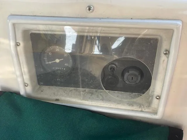 Slide: The Image of Instrument panel of a 1991 Hunter 30T boat, featuring a gauge and controls. - 19