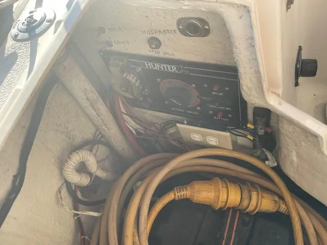 Slide: The Image of Control panel of a 1991 Hunter 30T boat with electrical cables. - 23