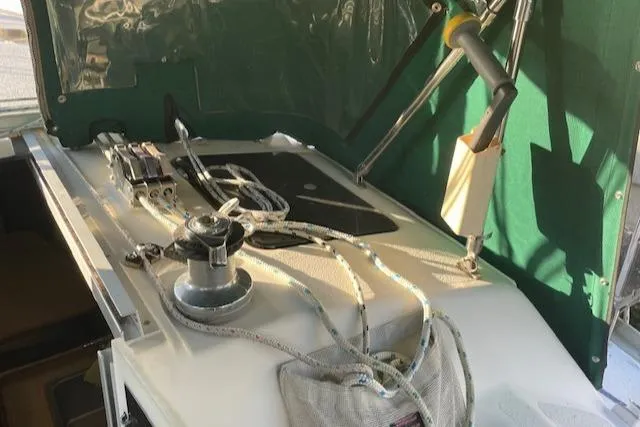 Slide: The Image of Sailboat deck of 1991 Hunter 30T with winch and ropes. - 30