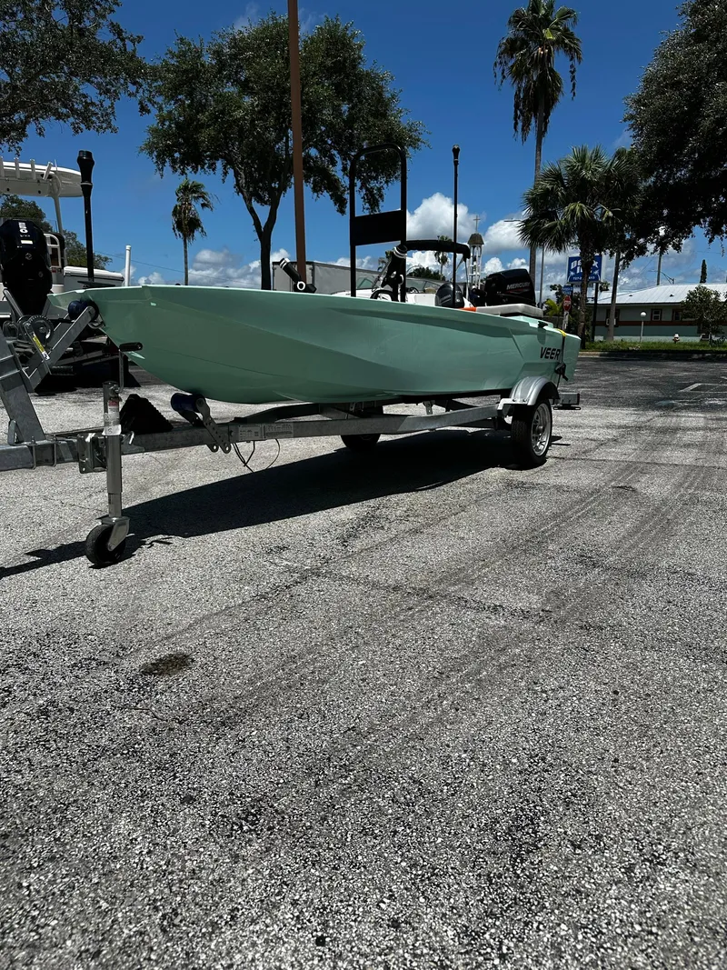 Slide: The Image of 2023 Veer V13 boat on trailer in sunny outdoor setting with trees. - 3