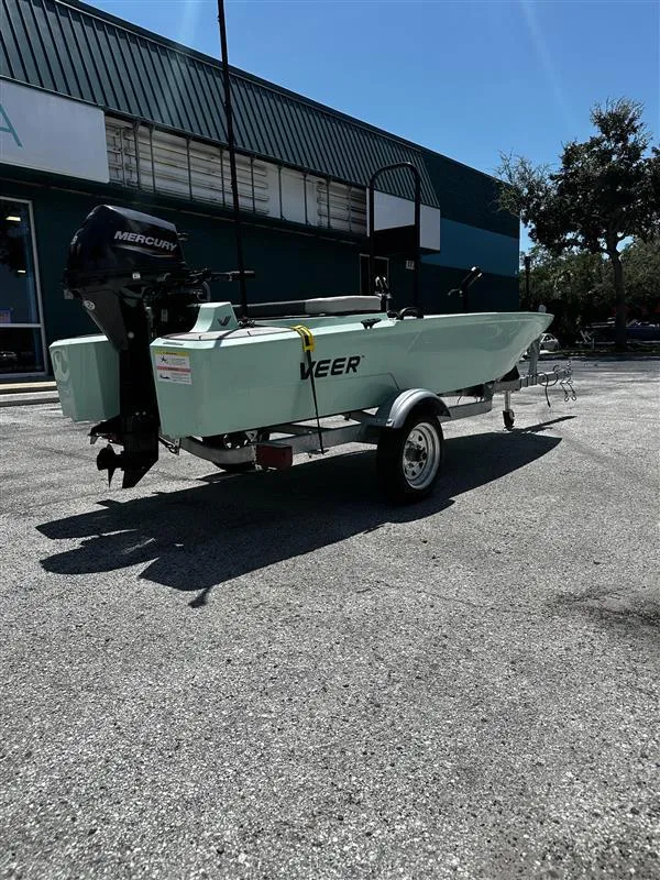 Slide: The Image of 2023 Veer V13 boat on trailer, parked outdoors, with Mercury outboard motor. - 5