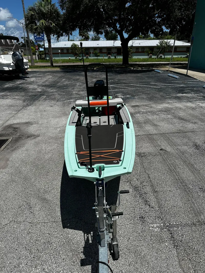 Slide: The Image of 2023 Veer V13 boat on trailer in parking lot, sunny day, palm trees in background. - 6