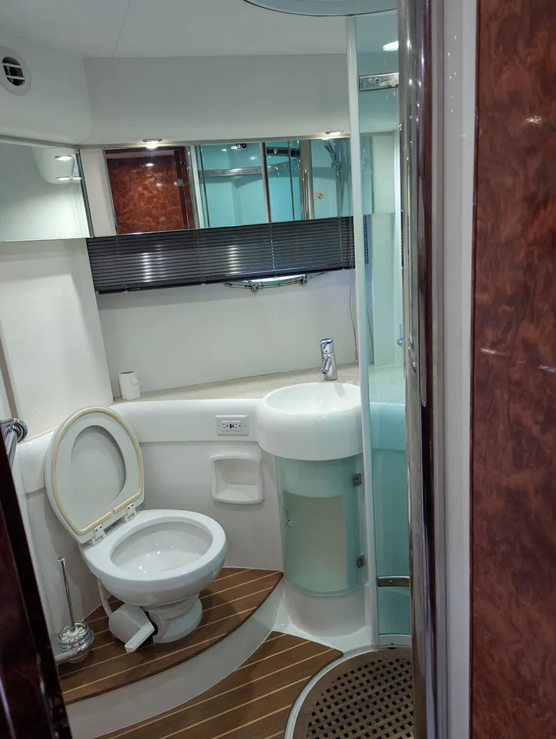 Slide: The Image of 2007 Fairline Targa 52 GT yacht bathroom with modern fixtures and wood accents. - 11