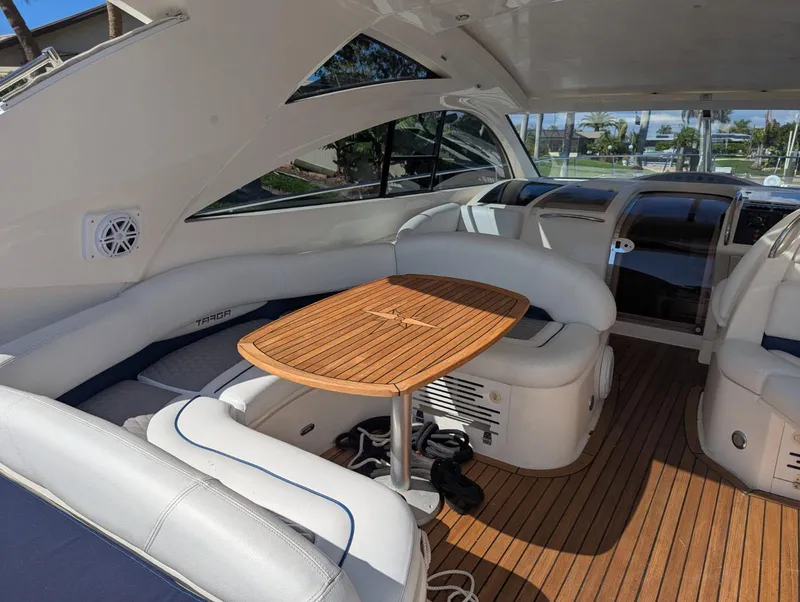 Slide: The Image of Interior of 2007 Fairline Targa 52 GT yacht with wooden table and white seating. - 4
