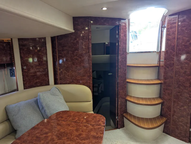 Slide: The Image of Interior of 2007 Fairline Targa 52 GT yacht with wooden stairs and seating area. - 7