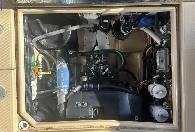 Slide: The Image of Engine compartment of a 2016 Cutwater C-26 boat, showcasing various mechanical components. - 11