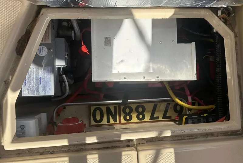 Slide: The Image of Engine compartment of a 2016 Cutwater C-26 boat, showing wiring and components. - 12