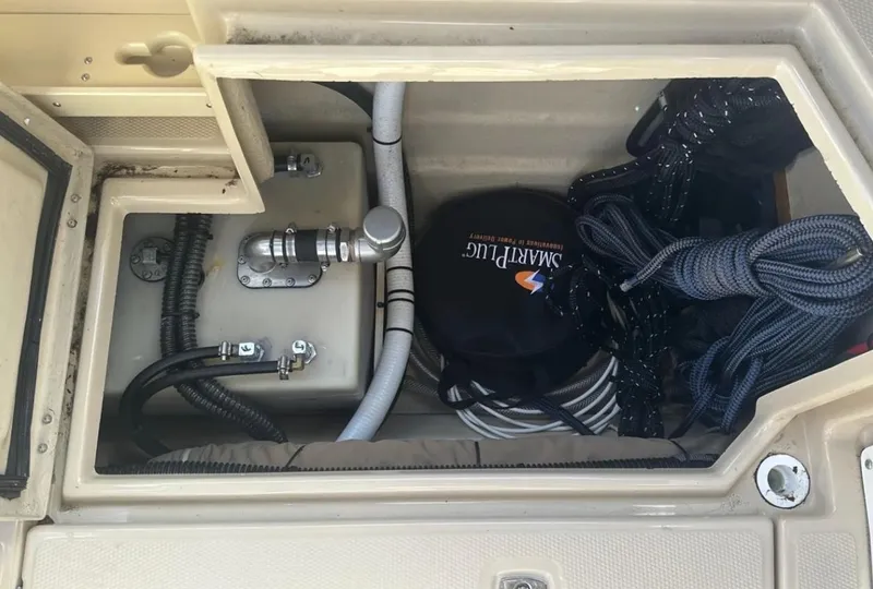 Slide: The Image of Storage compartment of a 2016 Cutwater C-26 boat with ropes and equipment. - 13