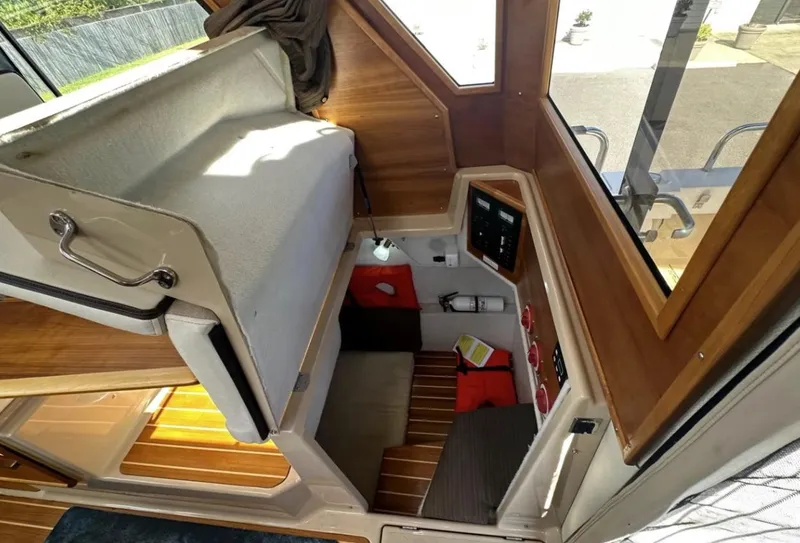 Slide: The Image of 2016 Cutwater C-26 interior with wooden accents and seating area. - 22