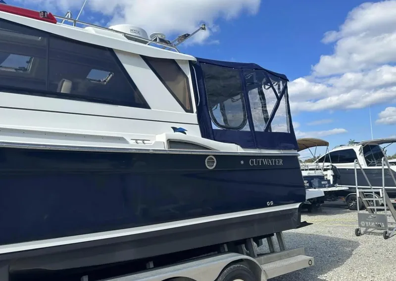 Slide: The Image of 2016 Cutwater C-26 boat on trailer under blue sky. - 6