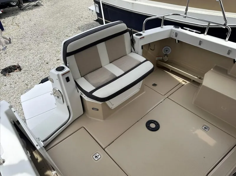 Slide: The Image of 2016 Cutwater C-26 boat interior with beige seating and deck. - 8