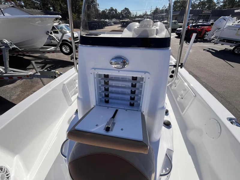 Slide: The Image of 2025 NauticStar 194 Bay boat interior with storage compartments and seating. - 11