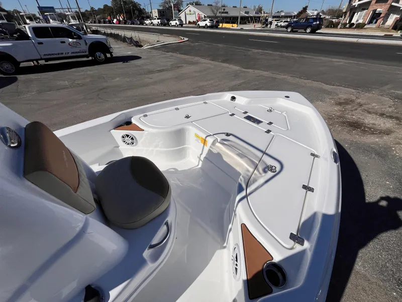 Slide: The Image of 2025 NauticStar 194 Bay boat interior with seating and storage compartments. - 9