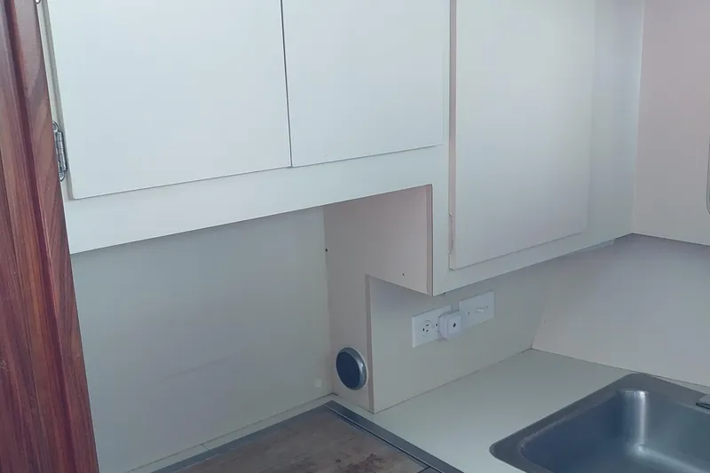 Slide: The Image of Interior of 1988 Hatteras 40 Double Cabin kitchen with sink and cabinets. - 14