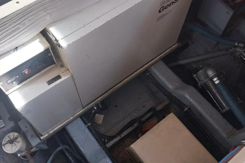 Slide: The Image of Engine room of 1988 Hatteras 40 Double Cabin with generator visible. - 26