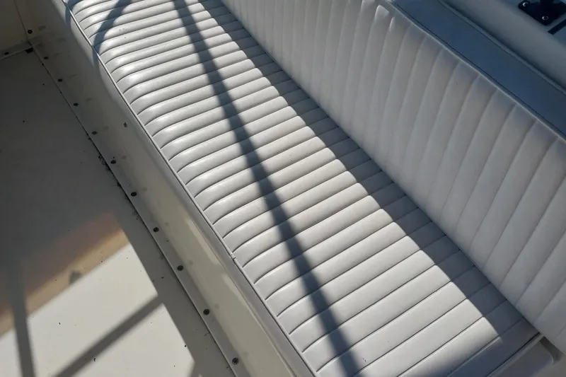 Slide: The Image of White cushioned seating on 1988 Hatteras 40 Double Cabin boat. - 4