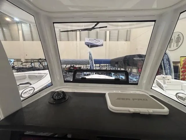 Slide: The Image of 2025 Sea Pro 242 Center Console interior view at a boat show. - 17