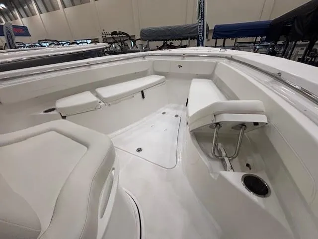 Slide: The Image of 2025 Sea Pro 242 Center Console boat interior with white seating and spacious layout. - 20
