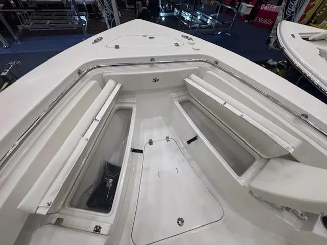 Slide: The Image of 2025 Sea Pro 242 Center Console boat interior with open storage compartments. - 21